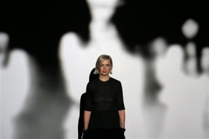 Artist Price poses for a photograph in front of her video installation 'THE WOOLWORTHS CHOIR OF 1979' after winning Britain's Turner Prize at Tate Britain in London