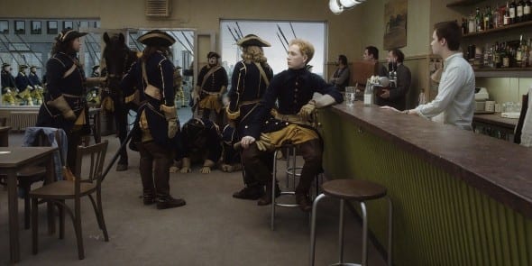 Un-piccione-seduto-su-un-ramo-riflette-sull'esistenza