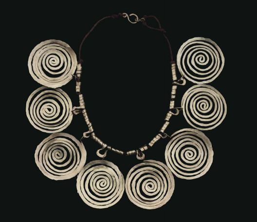 Alexander Calder (1898-1976) Necklace brass wire and string overall: 4 3/4 x 20 5/8 in. (12 x 52.3 cm.) loop: 13 in. (33 cm.) Executed circa 1940.