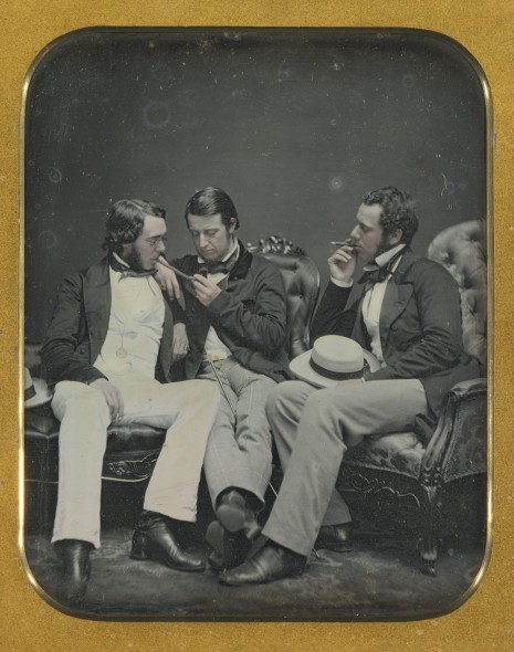 Anonymous American Photographer THREE MEN SMOKING three-quarter-plate daguerreotype, with hand-coloring and gilt-detail, cased, 1840s