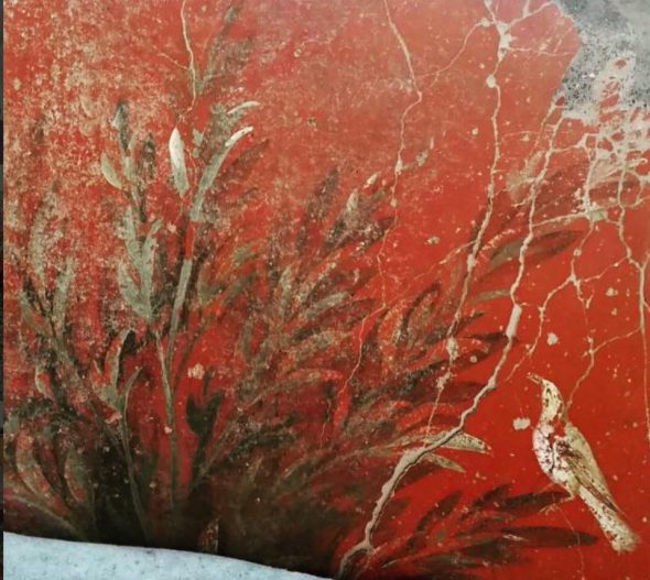 Pitture murarie a Pompei raffiguranti un giardino su sfondo rosso pompeiano