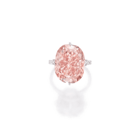MAGNIFICENT PLATINUM, FANCY INTENSE ORANGY PINK DIAMOND AND DIAMOND RING The cushion-cut Fancy Intense Orangy Pink diamond weighing 15.23 carats, the mounting accented by round diamonds weighing .76 carat, size 6¼. Estimate 6,000,000 — 7,000,000 USD  LOT SOLD. 6,101,000 USD