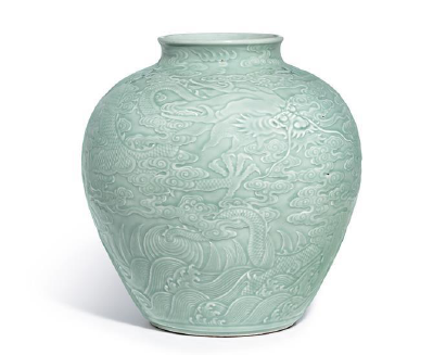 A Magnificent Carved Celadon-Glazed ‘Dragon’ Jar