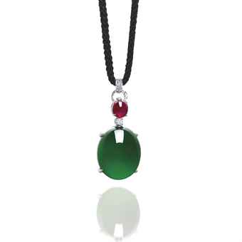 A jadeite cabochon pendant of 26.1 x 21.3 x 14.5 mm US$5,676,480 WORLD AUCTION RECORD PRICE FOR A SINGLE JADEITE CABOCHON